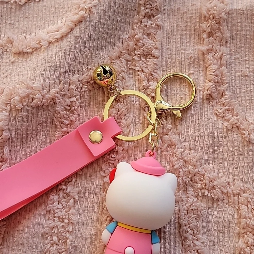 Hello Kitty, silicon keychain. NWOT. Metal hooks, pink and white 💗.